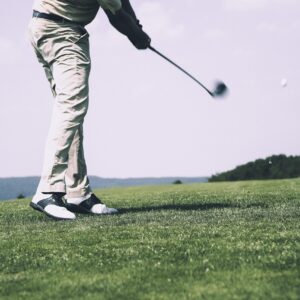 Golf ball on a tee on a golf course