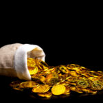 Stacked gold coins spilling from a treasure sack