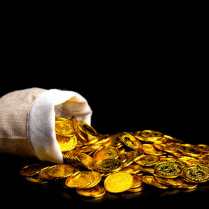 Stacked gold coins spilling from a treasure sack